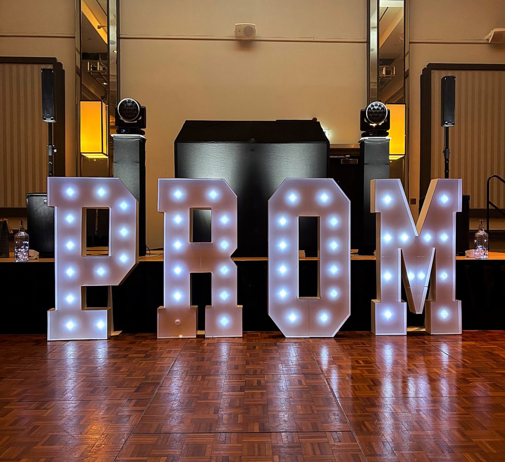 Light-up PROM letters in front of the DJ booth at the Crowne Plaza Glasgow prom